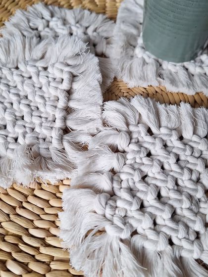 A full set of the square woven coasters, ready for a get-together with friends. They are both functional and decorative.