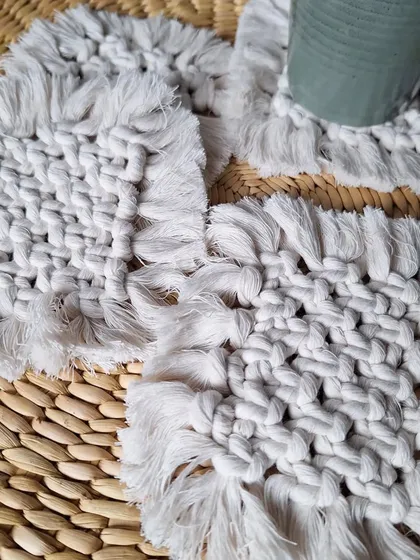 A full set of the square woven coasters, ready for a get-together with friends. They are both functional and decorative.