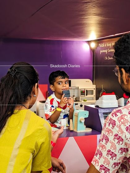 A hilarious moment of a little cashier "billing" his parents at the pretend play cafe. It's these imaginative interactions that make playtime so special.