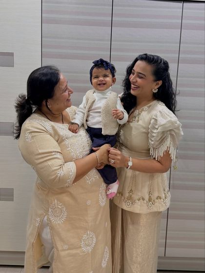 Another beautiful moment from the same series, this time with all of us looking at each other and smiling. It captures the love and connection between a daughter, mother, and grandmother.