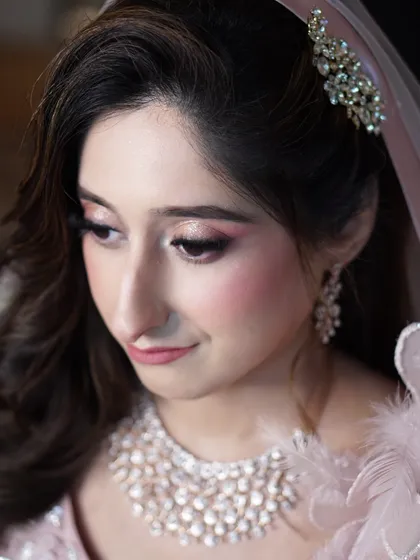 The soft focus on Aaliyah's engagement makeup highlights its romantic quality. The gentle pinks and subtle shimmer create a look that is both timeless and perfectly suited for a bride-to-be.