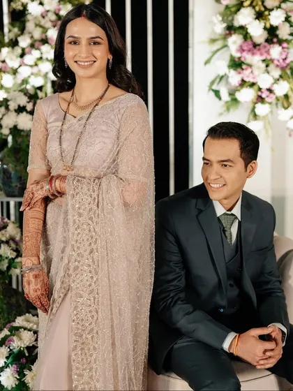 The joy of being together. A candid shot of the couple enjoying their reception, surrounded by beautiful decor and the love of their family.