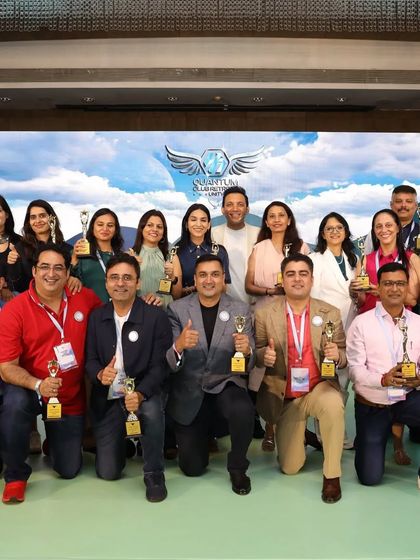 A group photo of award winners at a Quantum Club event. We celebrate every win, big and small.