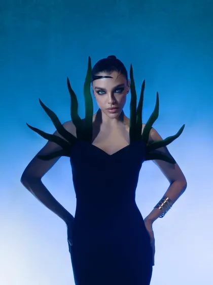 This shot is from a futuristic fashion series, where I played with colored gels and hard lighting to sculpt the model's form. It demonstrates my technical skill in creating a high-impact, otherworldly mood for cutting-edge brands.