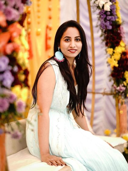 A guest enjoying the Mehendi celebration. We decorated a swing with colorful flowers, creating a perfect spot for guests to sit, relax, and take beautiful photos.