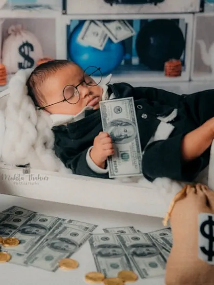 It's all about the money. This tiny CEO is already a high roller in his Boss Baby themed photoshoot.
