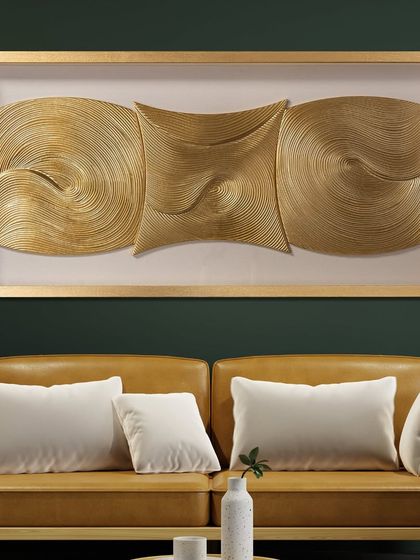 The Cosmic Currents shadow box is a mesmerizing piece of abstract art. The three-dimensional golden waves and swirls create a sense of movement and balance, perfect for a modern living room.