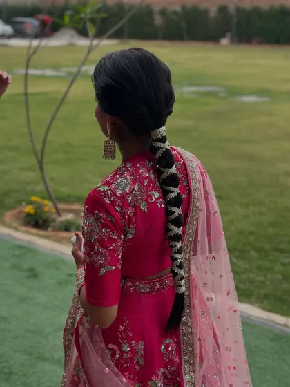A beautiful Mehndi braid woven with delicate white gajra flowers. This style is a classic choice that adds a touch of tradition and fragrance to the look.
