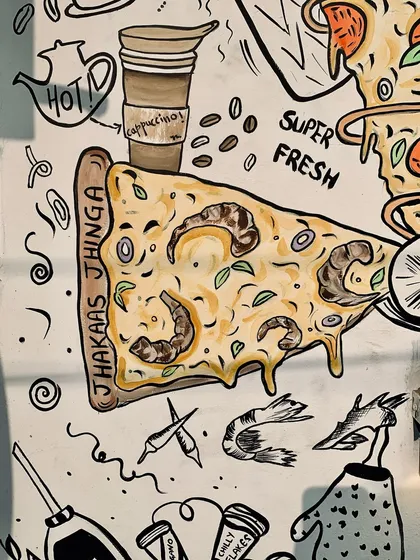 For a pizza café in Delhi, I turned their bestsellers into quirky, illustrated food puns. This close-up shows the "Jhakaas Jhinga" pizza, part of an exterior mural designed to capture the fun and flavor of their brand.