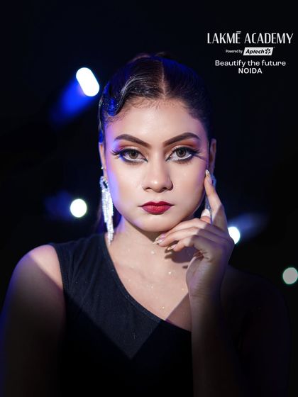 A powerful headshot of the final look, highlighting the sharp, graphic eyeliner and bold red lip.