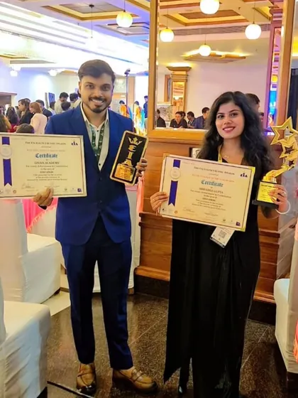 Both of us together with our awards. Givan Academy is a team effort, and we are so proud to build this institution together, dedicated to our students' growth and success.