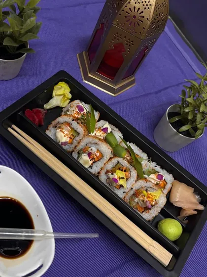 Rice to meet you! This elegant sushi platter is perfect for a sophisticated dinner, complete with soy sauce, wasabi, and pickled ginger.