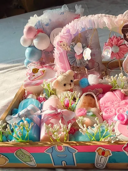 Another angle of the elaborate "Mom to be" hamper, showing the beautiful decorations and variety of products.