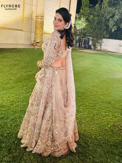 Another shot of this gorgeous sequined lehenga, showing off the intricate work and the beautiful back design of the blouse. Rent this look and get ready for the compliments.