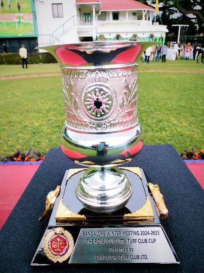 The Royal Calcutta Turf Club Cup, a large, intricately detailed silver cup.