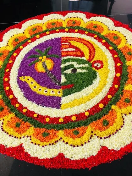 Let us create a stunning Pookkalam for your celebration. This intricate floral carpet, featuring a traditional Kathakali and Maveli design, is made with fresh, vibrant flowers to become the centerpiece of your event.