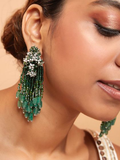 Our emerald green beaded danglers are a classic choice for adding a touch of royal elegance to your look.