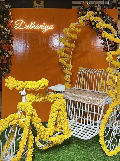 Bringing the classic 'Dil Wale Dulhaniya Le Jayenge' feel to life for a Haldi ceremony. We used a cycle rickshaw decorated with bright marigolds and a custom 'Dulhaniya' neon sign for the perfect fun and traditional photo op.