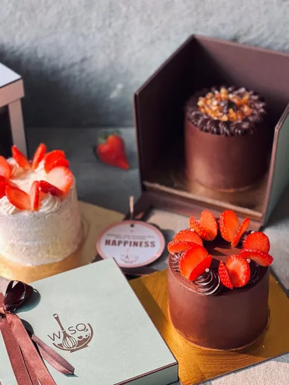 A trio of my mini cakes, including strawberry and chocolate caramel flavors, showcasing the variety available for gifting and personal celebrations.