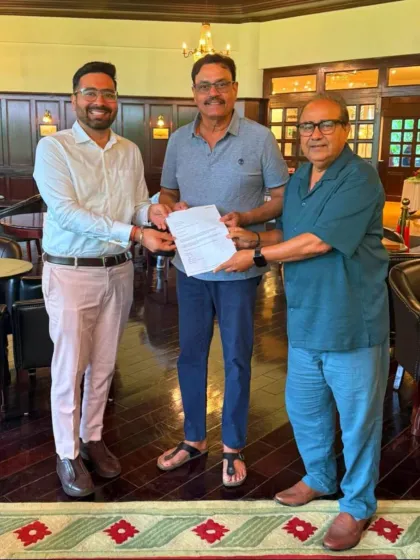 We also facilitate opportunities abroad. Here, a sponsorship document is being handed over for our 16-year-old player to play in Manchester.