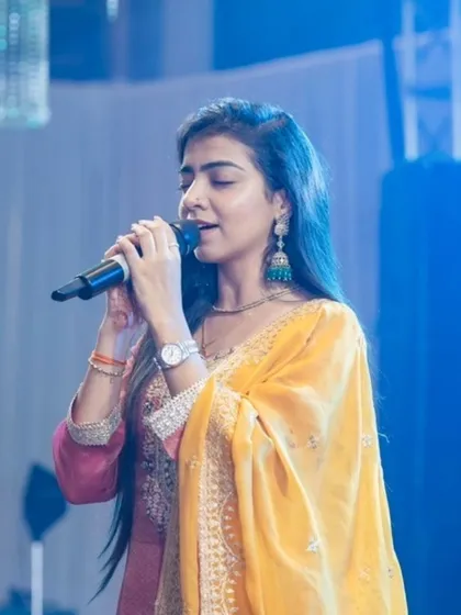 Lost in the melody, I sing from the heart. This is me in my element, connecting with the music and the audience to create a truly divine atmosphere at your event.