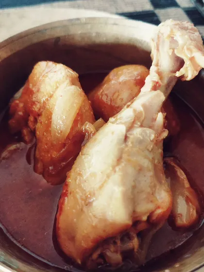 The quintessential Bengali Murgir Jhol, or home-style chicken curry. This light, soupy curry with tender chicken and potatoes is the ultimate comfort food, a dish that promises a satisfying meal and a happy afternoon nap, the true 'bhaatghoom' way.