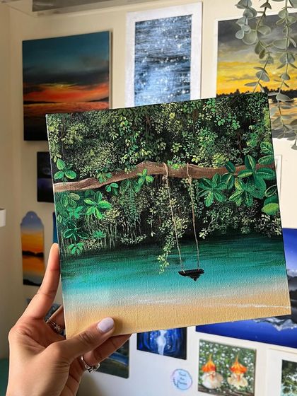 Holding the finished Maui painting in my studio.