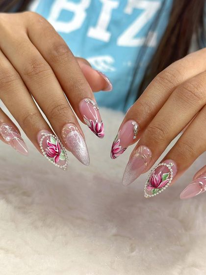 A side view of the luxe lotus bridal nails, highlighting the sharp stiletto shape and the intricate crystal work.