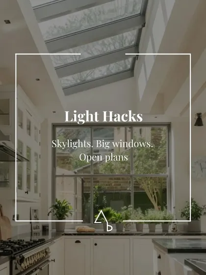 This post shares 'Light Hacks' like using skylights, big windows, and open plans to make a space feel brighter and more expansive.