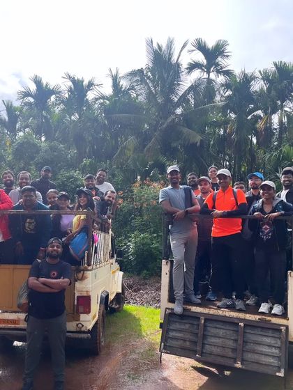 A group of trekkers enjoying the bumpy but scenic jeep ride on the way to Kodachadri peak.