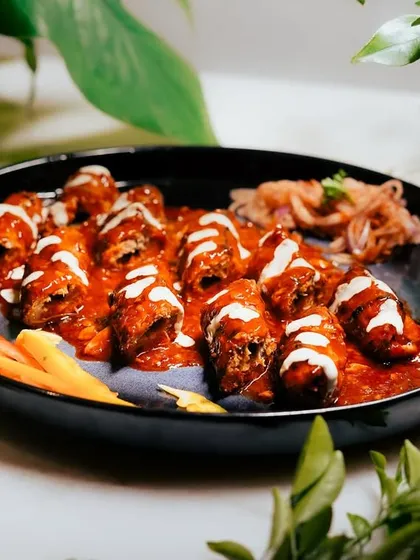 This is my Mutton Barra Seekh, featuring tender mutton pieces slow-cooked and drenched in a savory gravy, then drizzled with cream. It’s a rich and decadent dish perfect for special occasions.