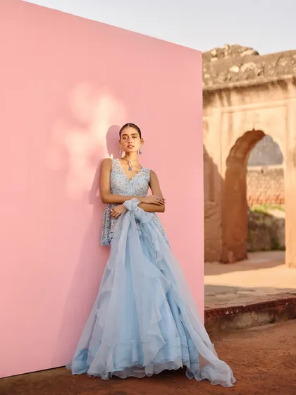 The full view of this ethereal blue lehenga from the Awigna shoot. The ruffled, layered skirt adds beautiful movement and texture.