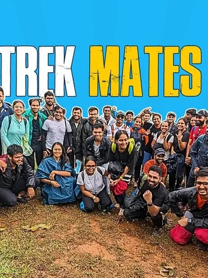 A "Trek Mates" graphic with a large group photo on a muddy summit. This celebrates the spirit of adventure and camaraderie, rain or shine.
