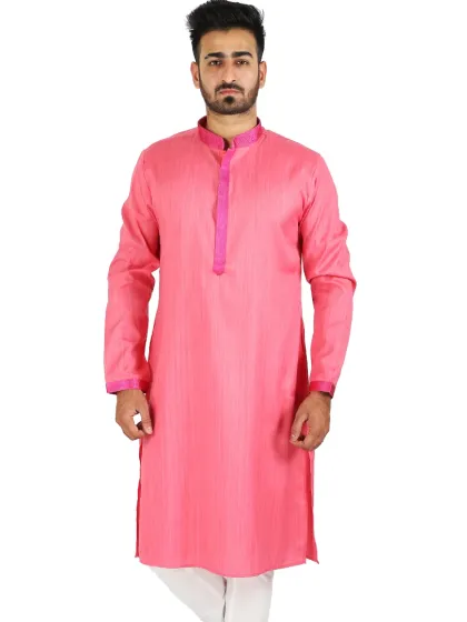 A full-length shot of a male model in a pink striped kurta with white trousers, providing a clear view of the complete ethnic wear set for online catalogs.