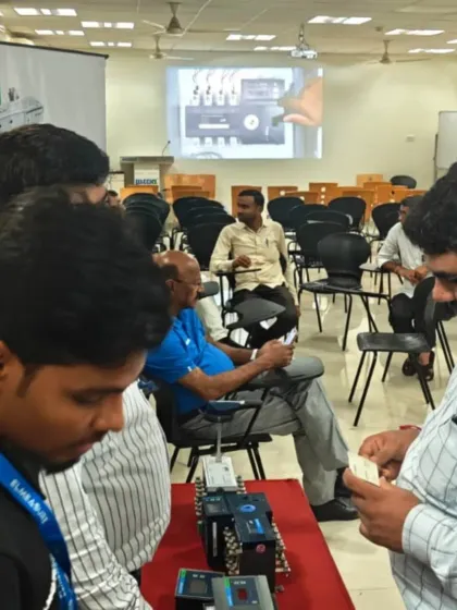 A presentation in progress at our Retailer Day at MCCIA, Bhosari. In the background, a slide details the features of our products, supplementing the hands-on demonstrations.