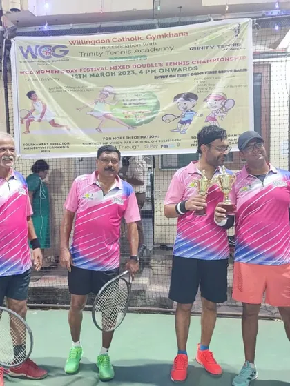 The runners-up of the Men's Doubles event with their trophies, showcasing the high level of competition.
