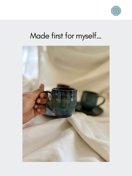 Holding the finished curved cup. The form is designed to feel balanced and comfortable in your hand.