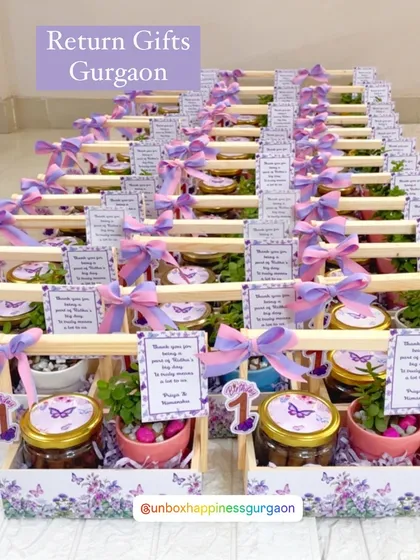A wide shot of the lavender butterfly-themed return gifts, perfect for a magical first birthday celebration.