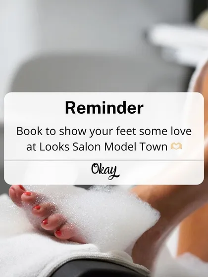 This is your friendly reminder to book some well deserved me time. A client's feet are seen soaking in a bubbly, cleansing foot bath, the first step towards total relaxation.
