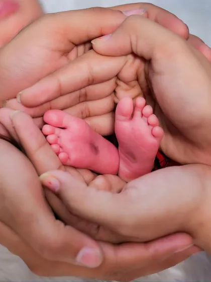 It’s all in the tiny details. A newborn's feet, so small and perfect, held safely in their parents' hands. This is one of the most requested shots in my newborn family sessions, a simple and powerful symbol of new life.
