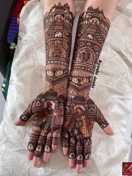 A clear, full view of the bride and groom design, showcasing the symmetry and storytelling from the palms to the elbows.