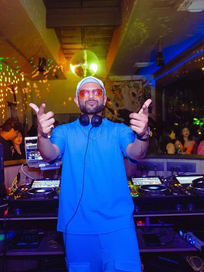 Badmaashi with a dash of charm. That's me, your DJ for the night, ready to bring the musical shenanigans.