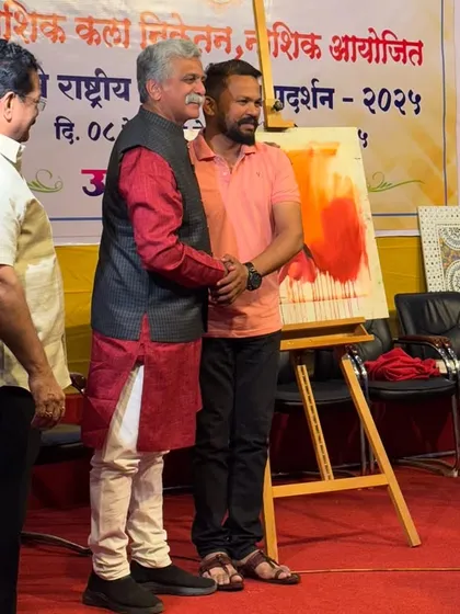 Receiving appreciation from the model after the live painting session was completed.