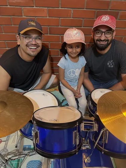 This picture says it all. A happy student after a great drum lesson with her instructors. We work hard to create a fun, encouraging, and positive environment where kids feel excited to learn and grow as musicians.