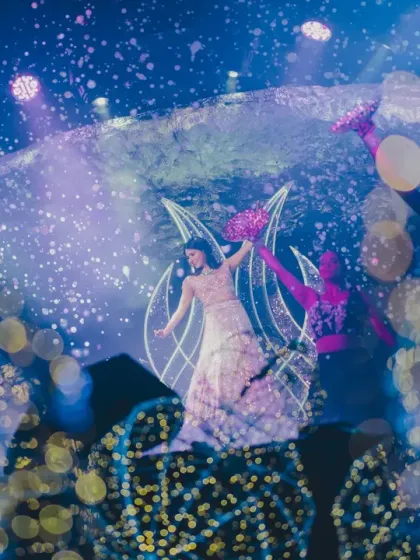 A creative, multi-layered shot of the bride's solo dance, capturing the energy and beauty of the 'Interstellar' themed stage.