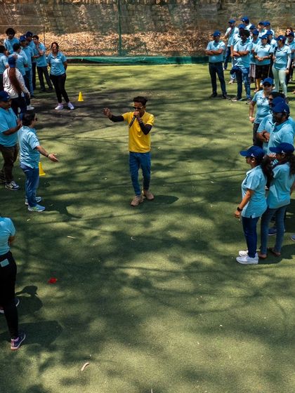 A team huddles up to strategize during a team building game. It's moments like these that strengthen bonds outside the office.