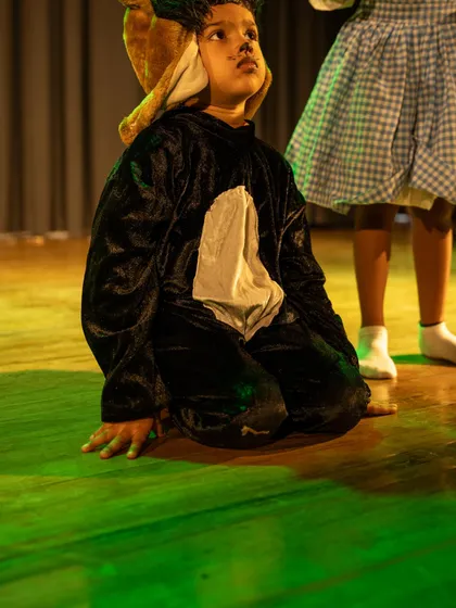 An actor portraying an animal character, demonstrating physical acting and the ability to transform his body to suit a role.