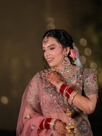 The joy of a modern bride. Muskaan's look is a beautiful example of how pastel outfits can be paired with soft, glowing makeup for a fresh and elegant wedding day style.