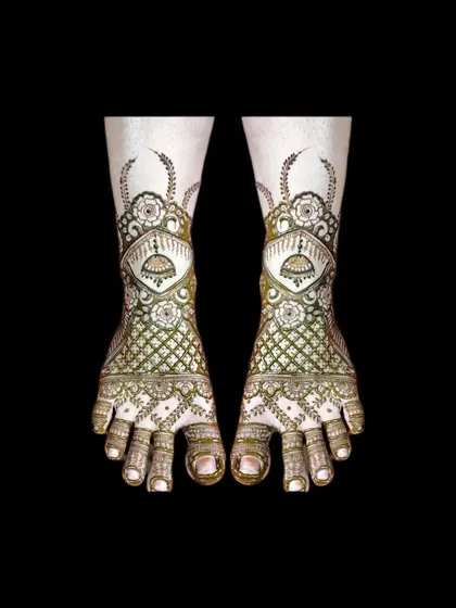 A very detailed and traditional bridal foot design. It features jhumkas, jaali work, and floral elements for a complete look.