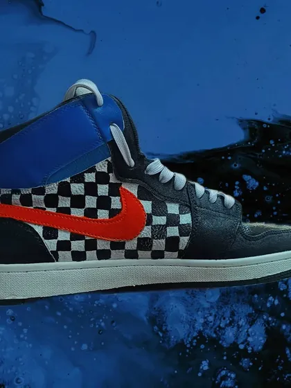 Your sneakers don't have to be boring. I customized these high-tops with a classic checkerboard pattern and a bold, contrasting swoosh, giving them a unique, retro skate vibe. I can paint on leather or canvas to completely transform your footwear.